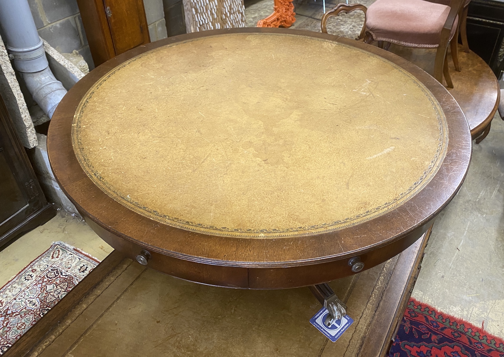 A reproduction mahogany circular drum coffee table, diameter 110cm, height 54cm